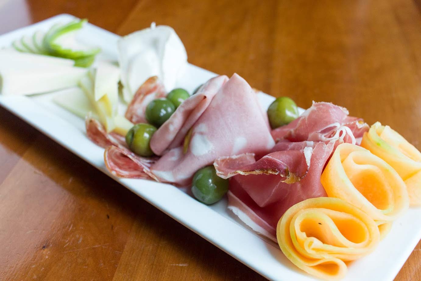 photo of smoked ham with cheese and olives